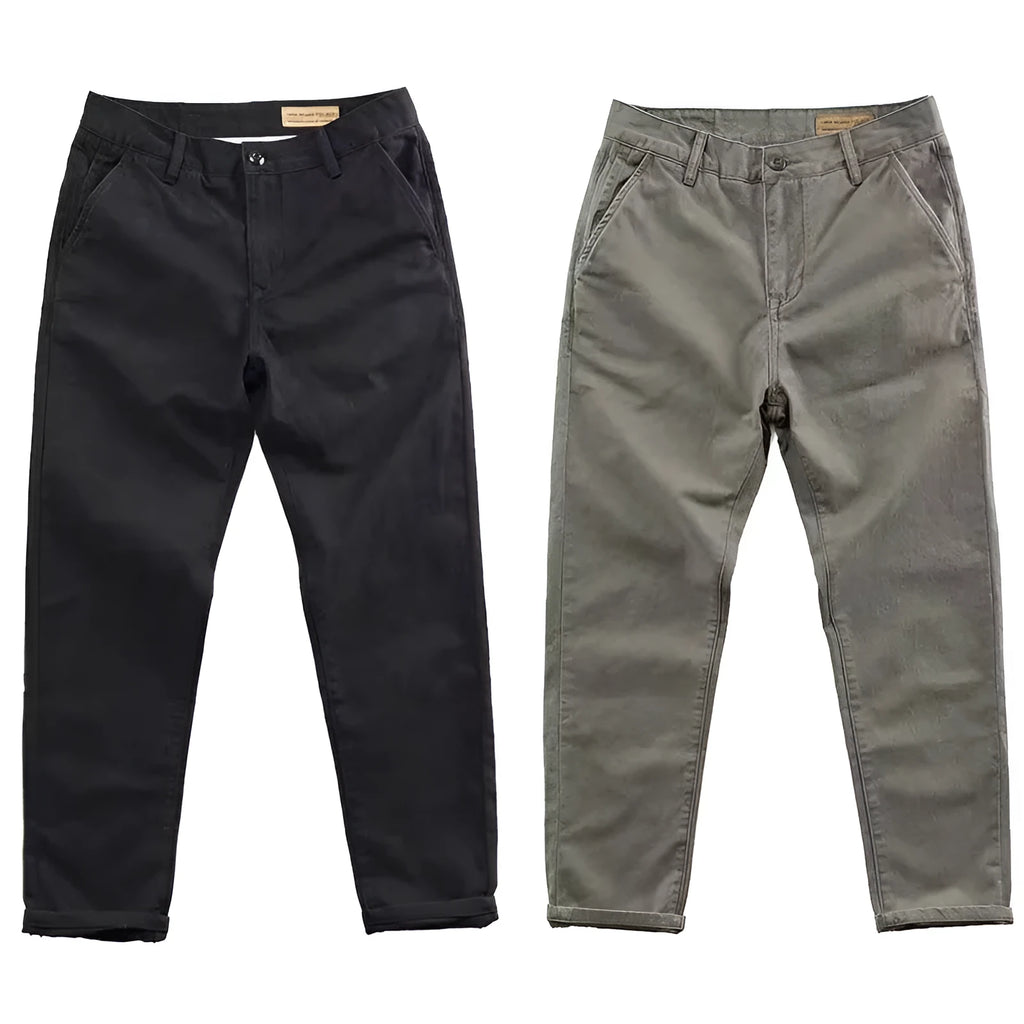 Man wearing slim fit straight-leg casual trousers in a grey washed fabric, showing business gentleman style.