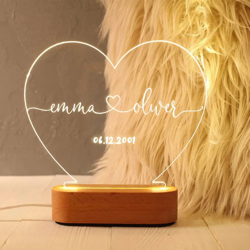 Custom transparent acrylic night light with LED base showing personalised text