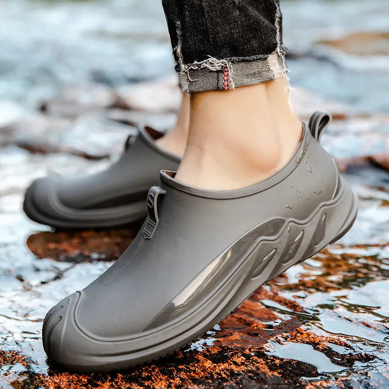 Men's plastic rain boots in solid colours with casual design for wet weather wear