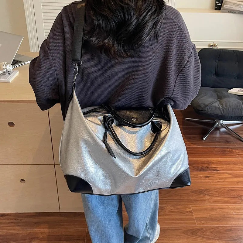 Black hand-carry travel bag for women with large 36-55 litre capacity