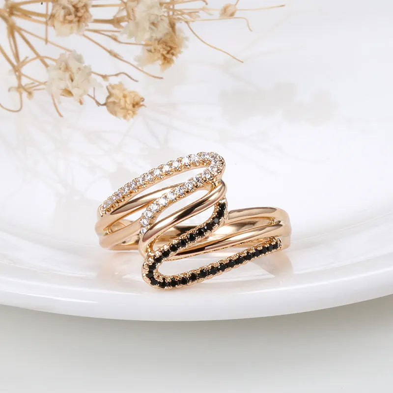 Close-up of a women's copper ring with micro-inlaid zircon stones and a silver-toned electroplated finish.