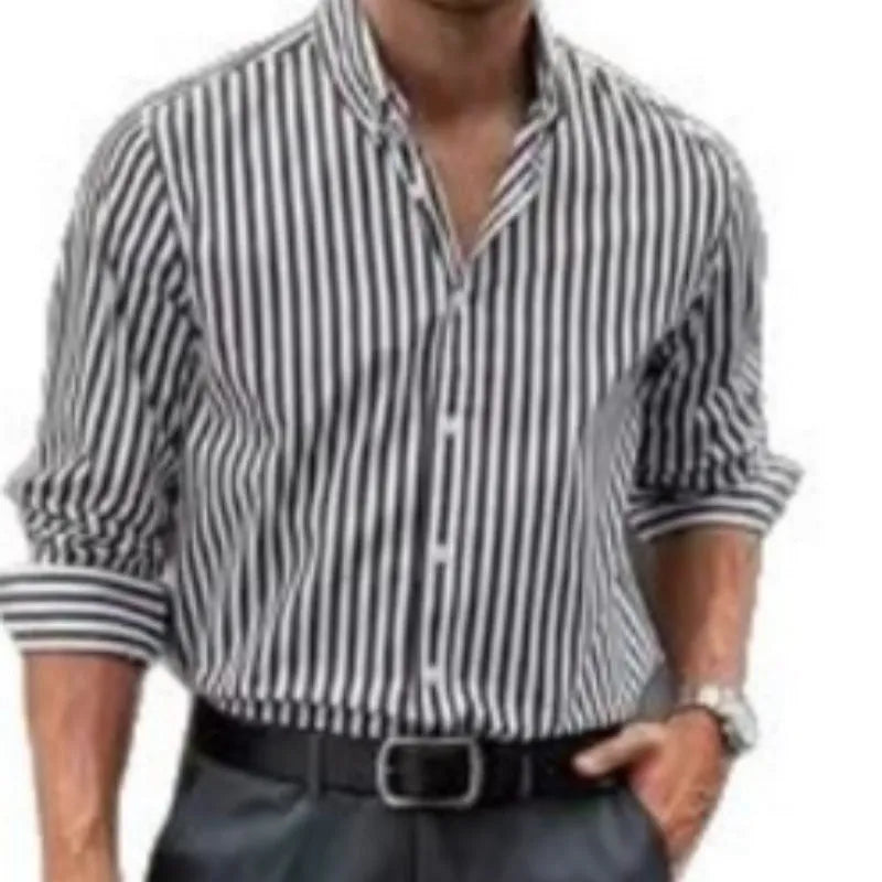 Man wearing a loose-fit khaki striped button-down cardigan-style shirt.