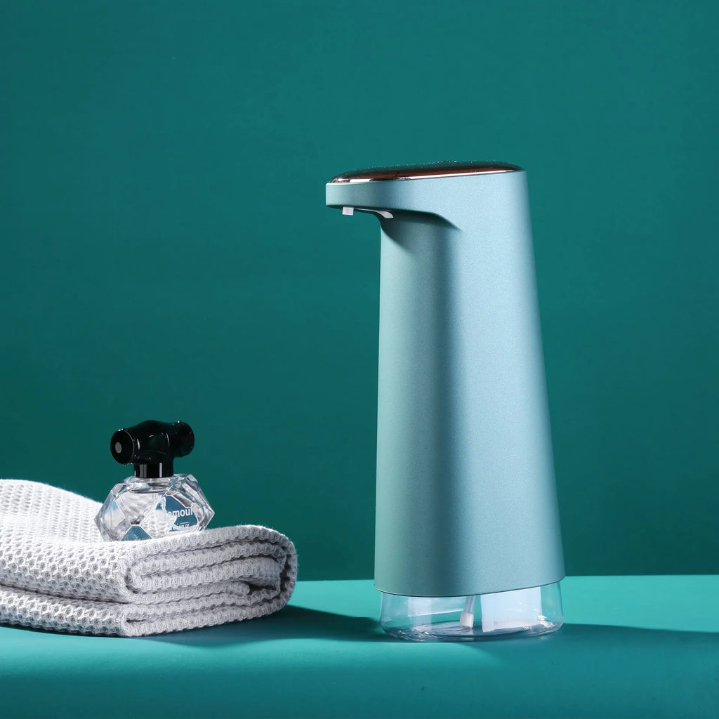Automatic foam soap dispenser with infrared sensor in white colour on bathroom counter