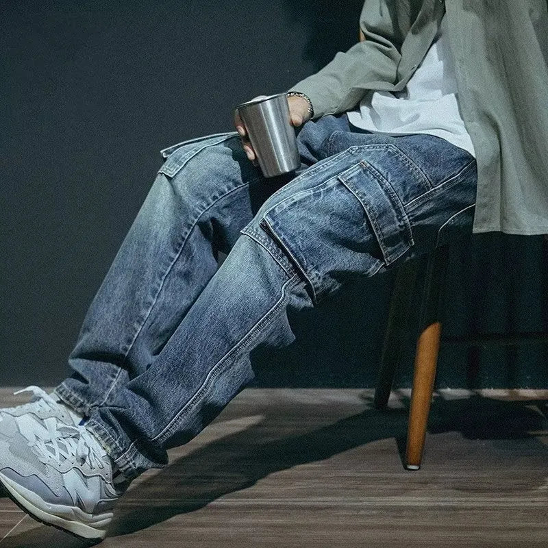 Man wearing blue loose straight leg stretch jeans in a casual setting