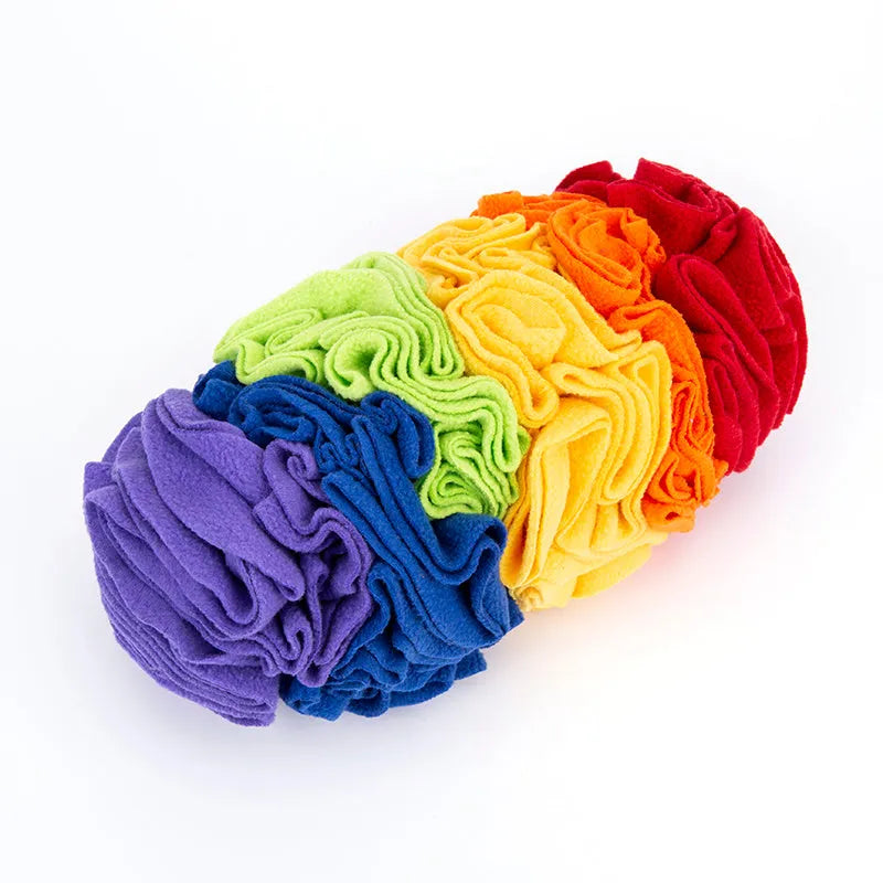 Dog snuffle pad made of polar fleece fabric in rainbow colour, 25x15cm, lying flat on floor