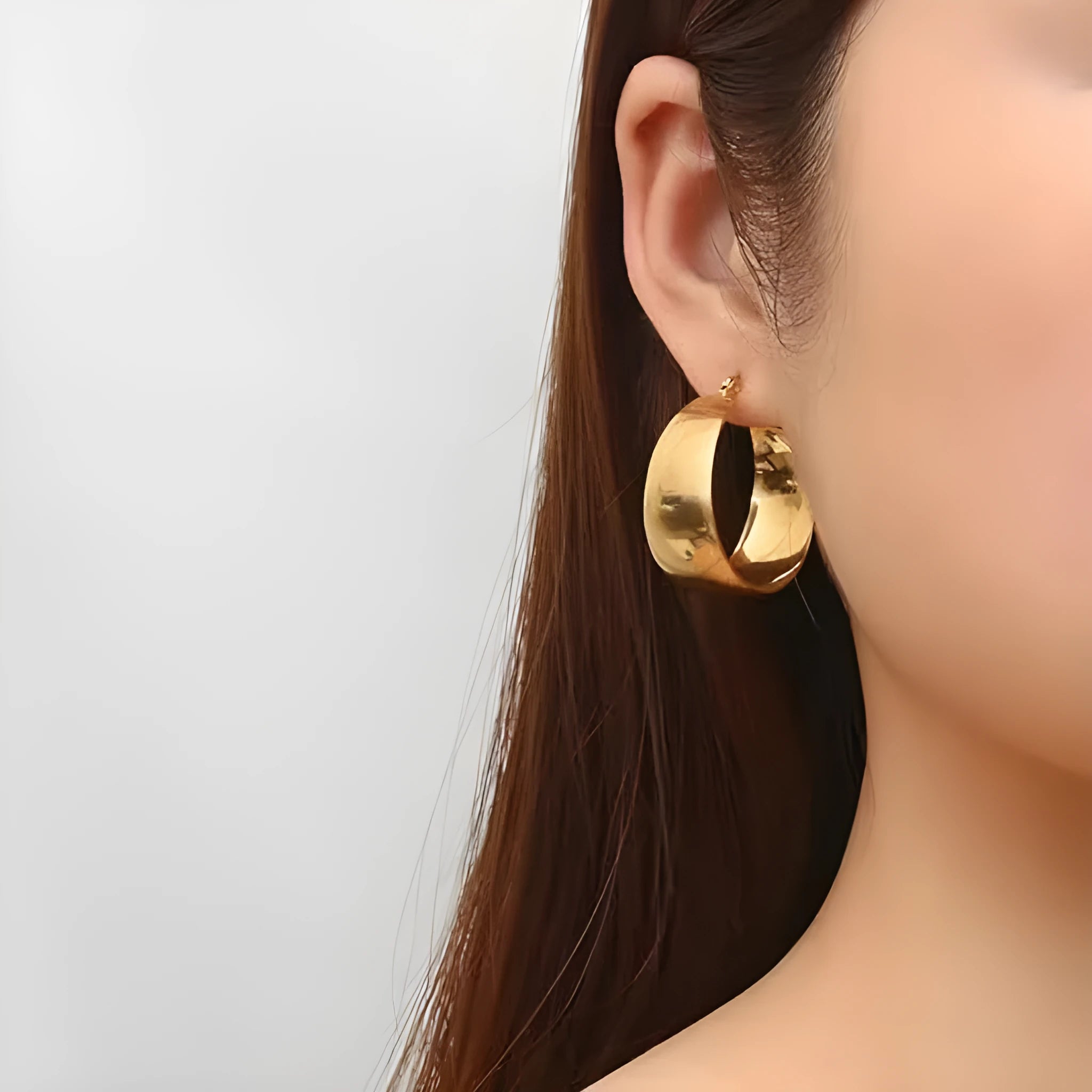 Curved widened stainless steel earrings with titanium steel in gold or steel colour, 25mm or 30mm sizes