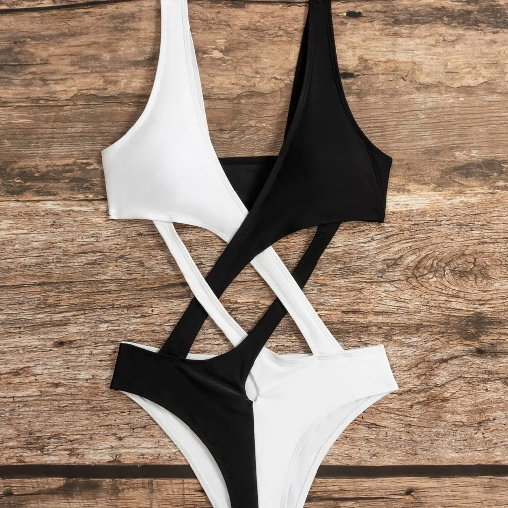 White women's one-piece swimsuit with colour-block pattern and hollow-out detailing