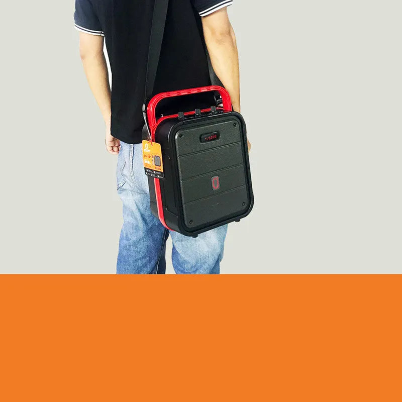 Black MS62AI portable Bluetooth speaker with wireless microphone and control knob on top.