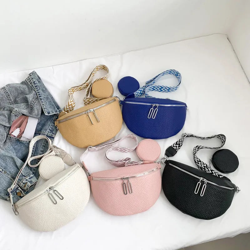 Women's solid colour textured PU crossbody bag with saddle lock hardware and clamshell opening