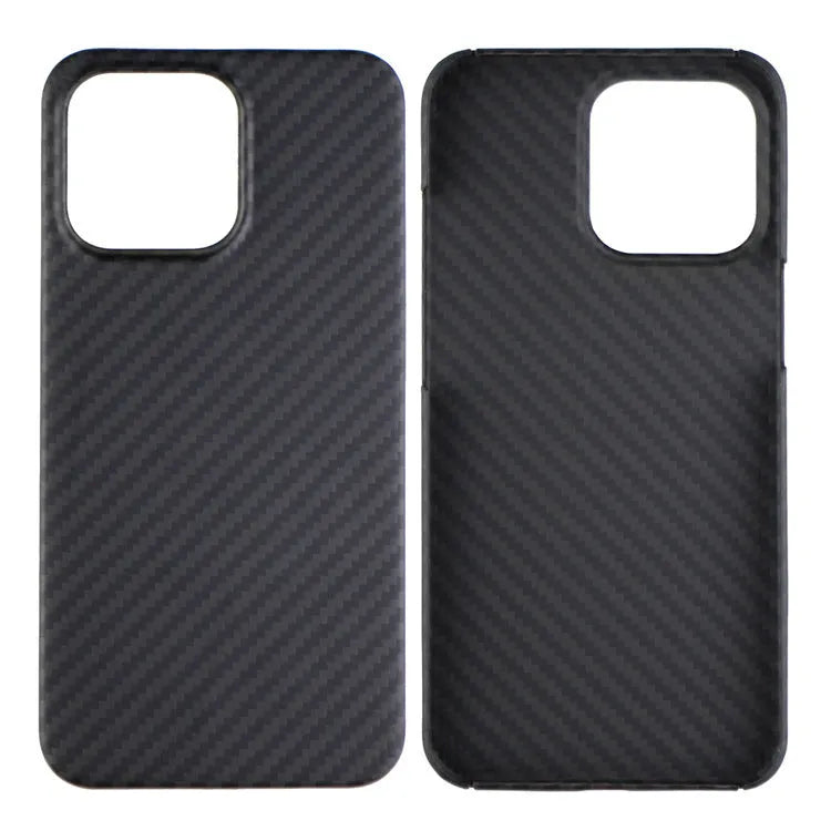 Dull black Kevlar iPhone case with volcanic crater texture next to a MagSafe charger.