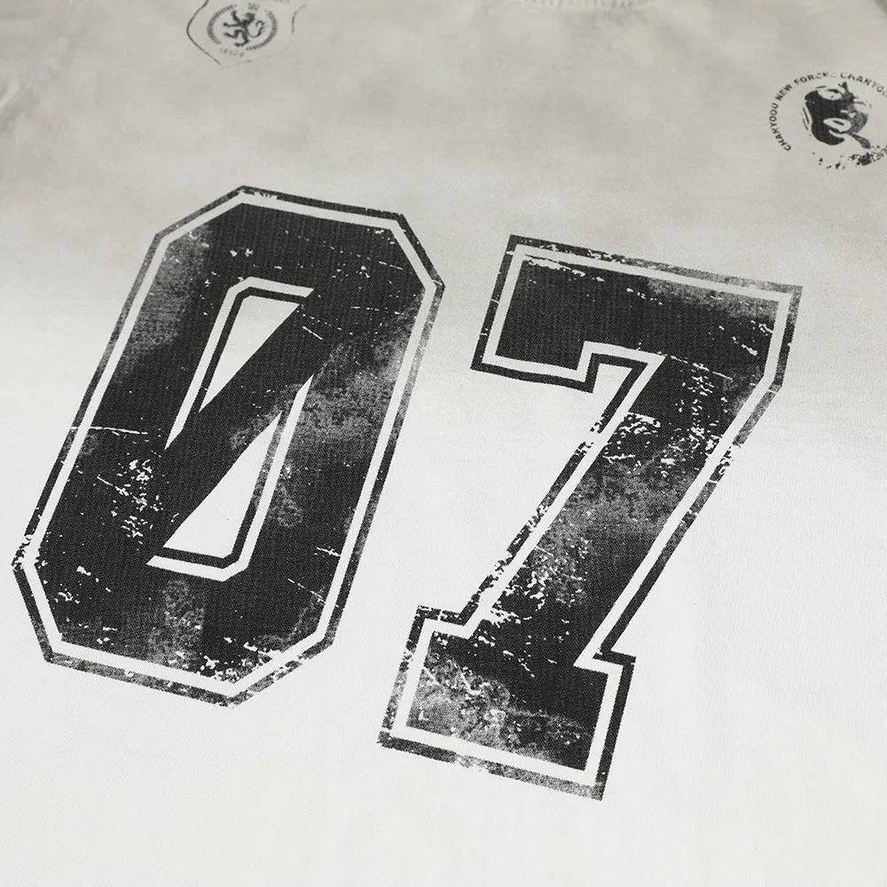 Men's black and white pure cotton short-sleeved printed t-shirt laid flat.