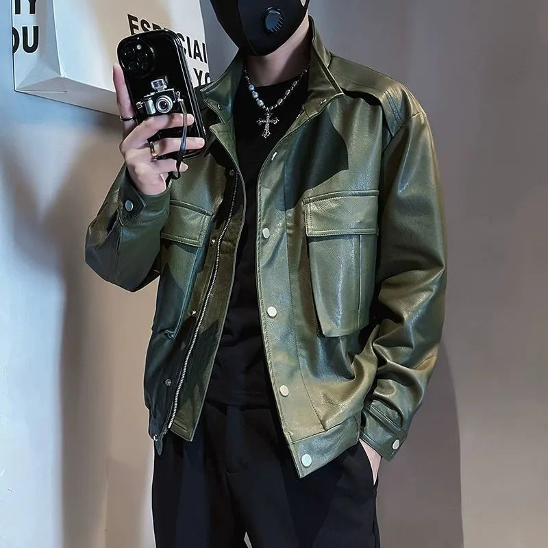 Man wearing a black PU leather pilot-style jacket with side pockets and a straight hem.