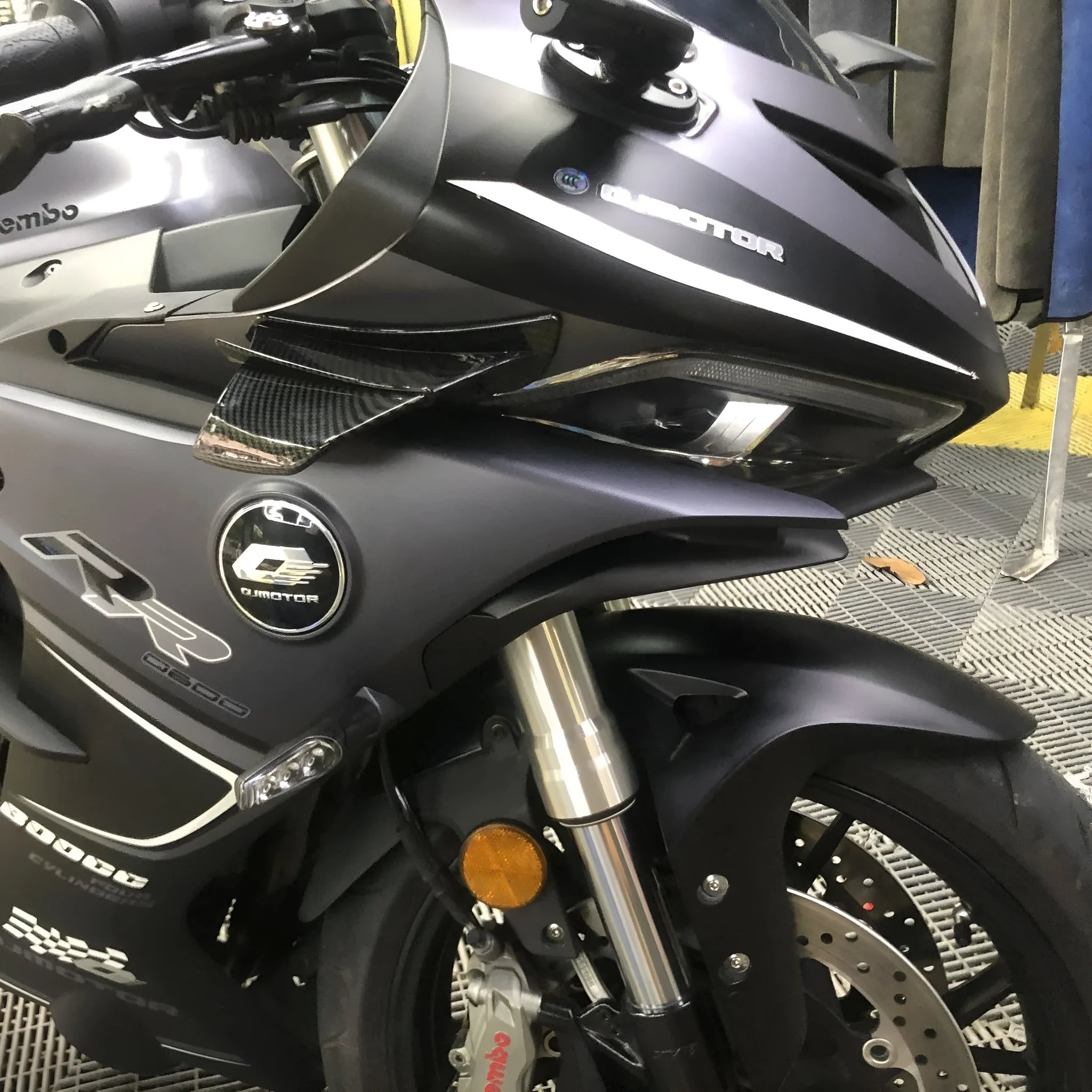 Universal motorcycle spoiler wing accessory in glossy carbon fibre pattern, dimensions 18cm by 8cm