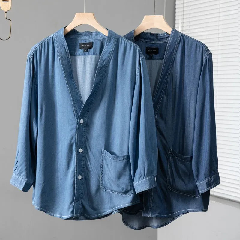Men's dark blue casual denim coat with V-neck collar and chest pocket on a hanger.