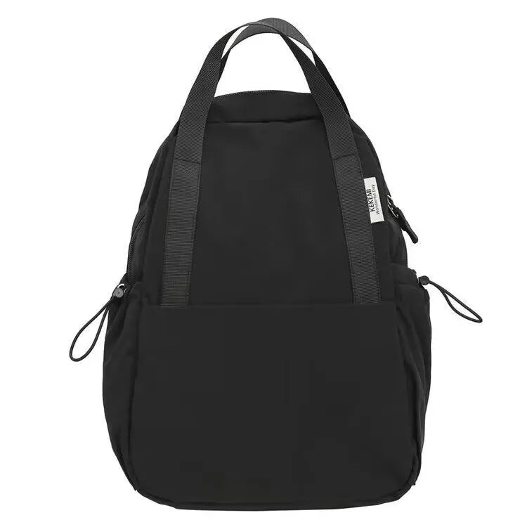 Solid colour nylon backpack with curved shoulder straps and a lock closure.