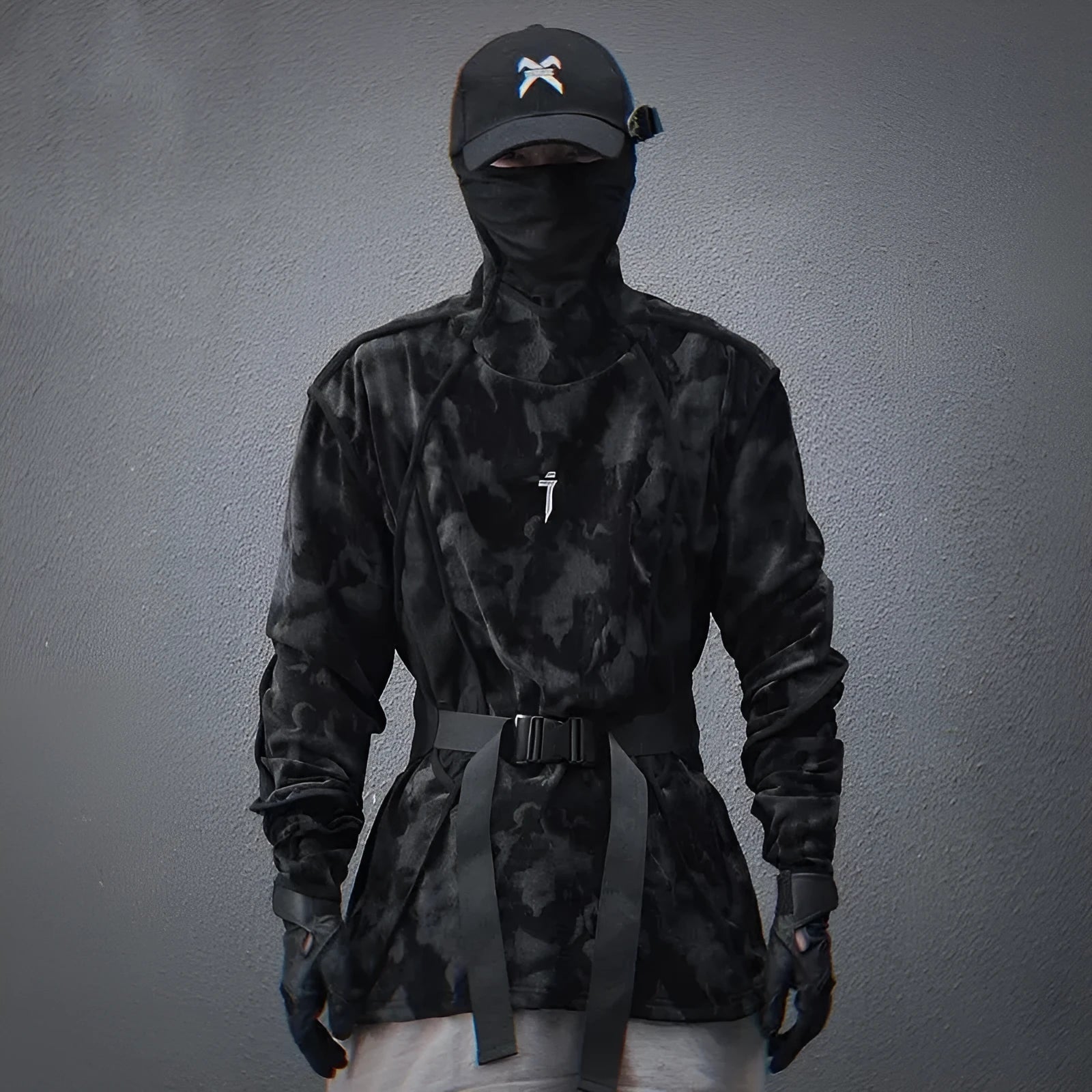 Man modelling a black and grey tie dye print loose fit pullover sweater with drop shoulders.