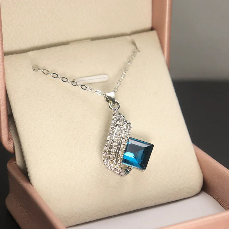 Glass pendant necklace with alloy cross chain and matching electroplated ear studs jewellery set