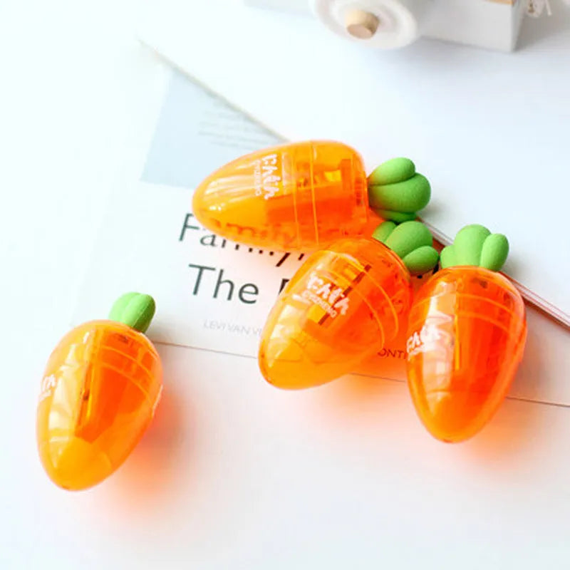 Orange carrot-shaped plastic pencil sharpener with cartoon design showing 7cm handle length