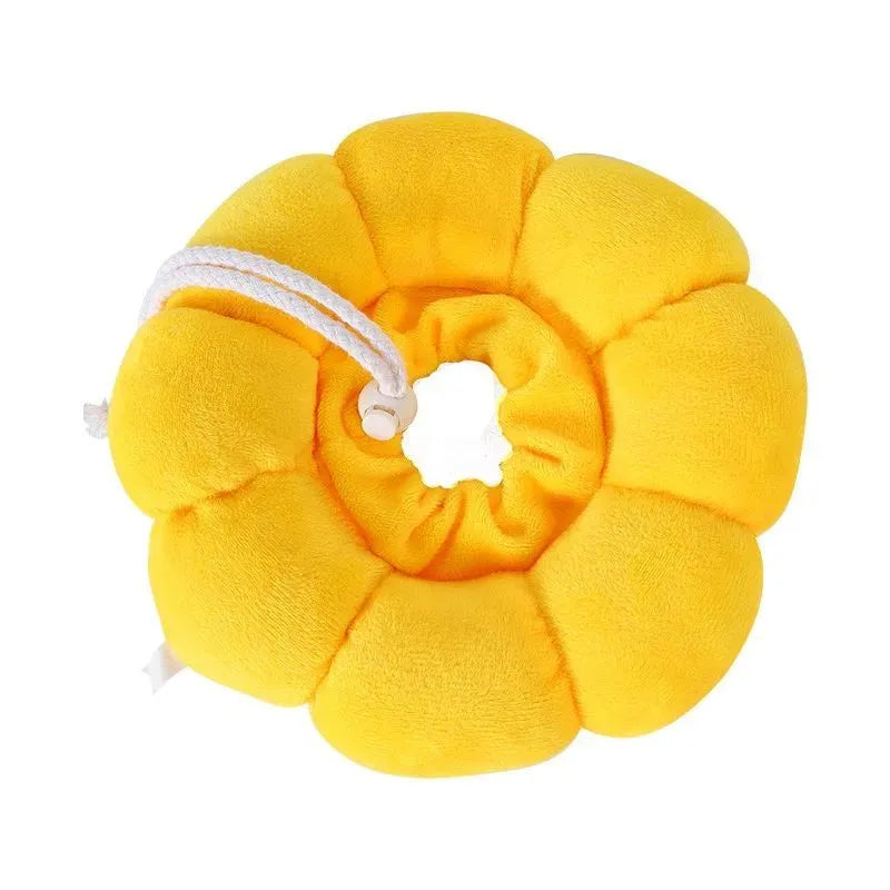 Soft white cotton pet protective collar for cats and dogs on a table, showing adjustable band and inner ring.