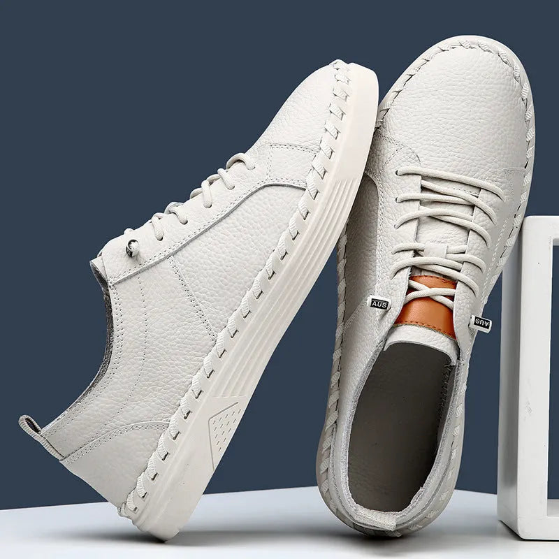 Men's beige and black cowhide leather sneakers with round toe and mesh lining.