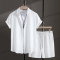 Men's black cotton blend short sleeve shirt and shorts suit set on a hanger.