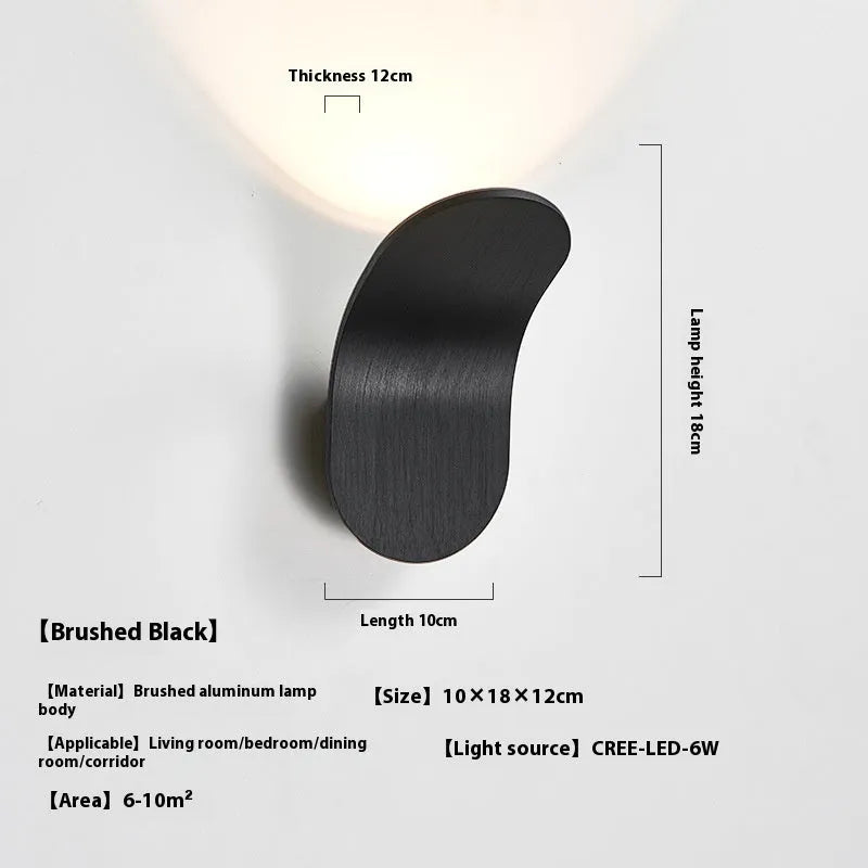 Modern brushed metal wall lamp in gold finish with contemporary design for accent lighting