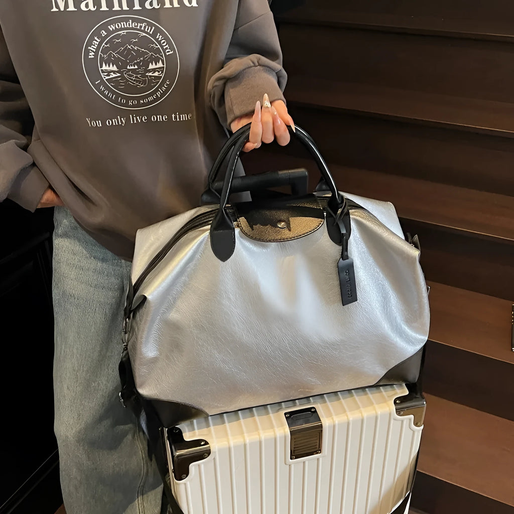 Black hand-carry travel bag for women with large 36-55 litre capacity