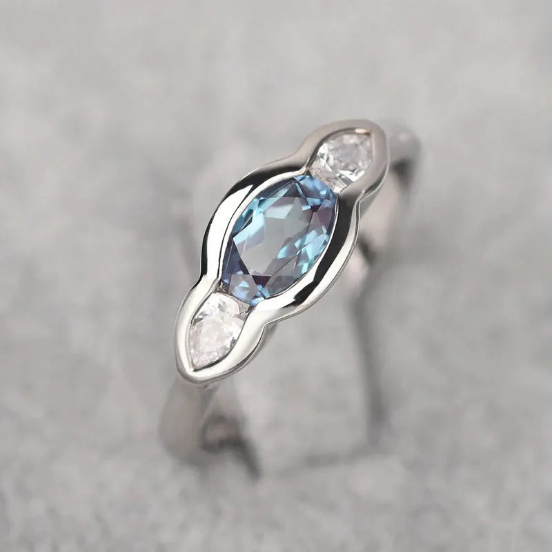 Geometric ellipse ring with zircon stones in white gold finish showing elliptical shape