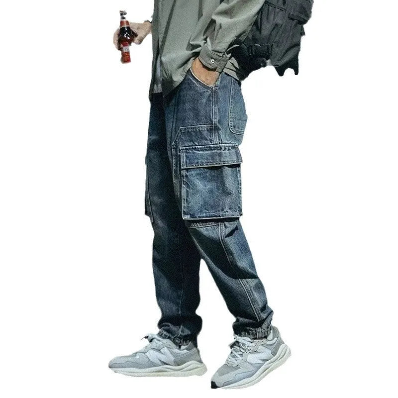Man wearing blue loose straight leg stretch jeans in a casual setting