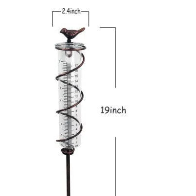 Cast iron outdoor rain gauge with hummingbird decoration and glass measurement tube showing 0-800ml scale.
