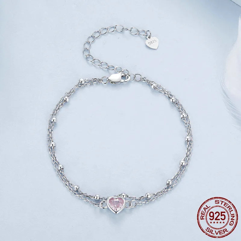 Sweet girlish heart-shaped 925 sterling silver bracelet on wrist, colour BSB152.