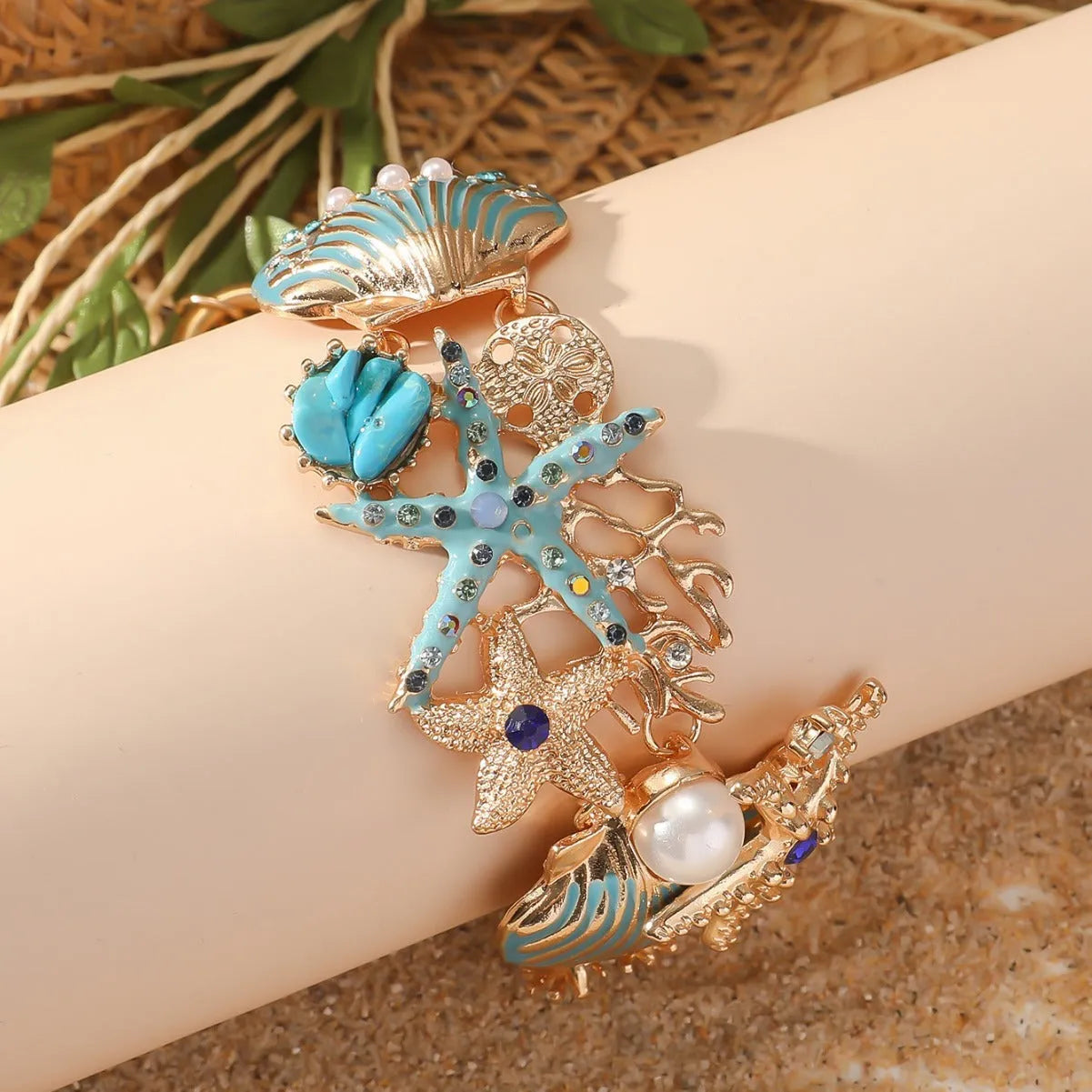 Alloy marine-themed bracelet with anchor and starfish charms in blue colour