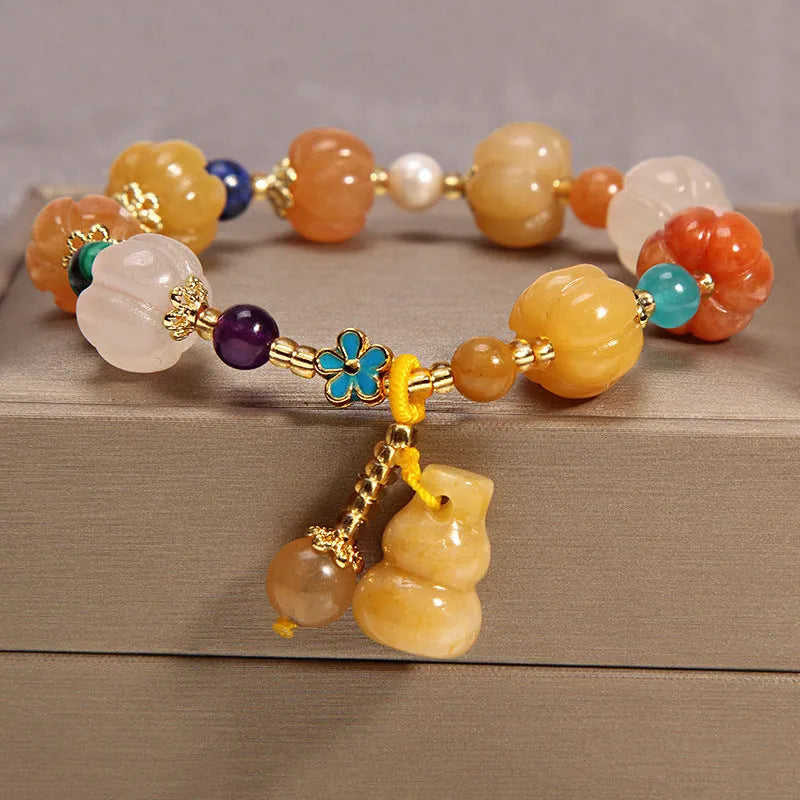 Women's adjustable crystal bracelet with yellow agate stones and gold silk thread.