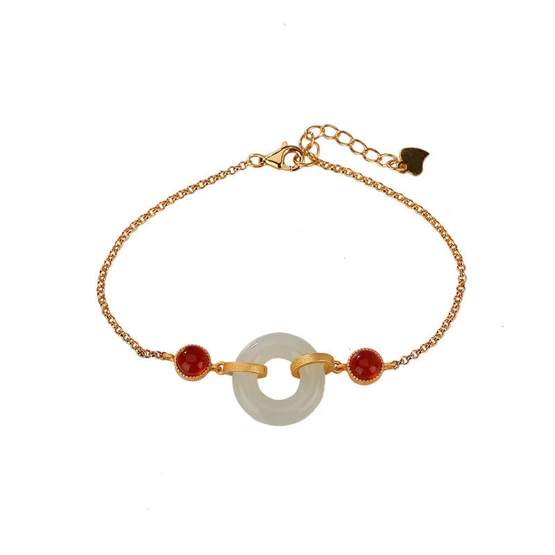 Gold-plated S925 sterling silver bracelet with inlaid natural Hetian jade stone and adjustable peace buckle clasp.