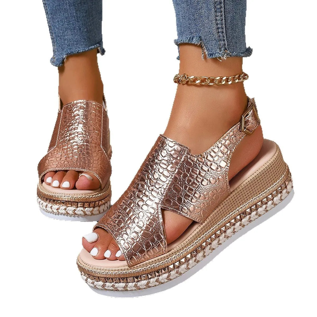 Gold women's Roman sandals with round toe, hollow-out upper, and an ankle buckle.