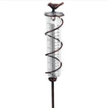 Cast iron outdoor rain gauge with hummingbird decoration and glass measurement tube showing 0-800ml scale.