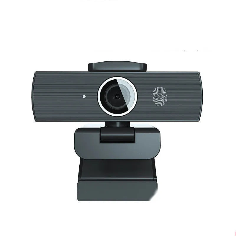 Black 4K USB webcam with magnetic privacy cover on a laptop screen