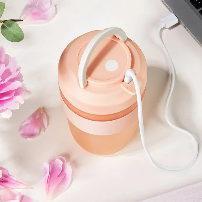 Portable USB rechargeable blender cup in purple, green or orange with 400ml capacity and four stainless steel blades