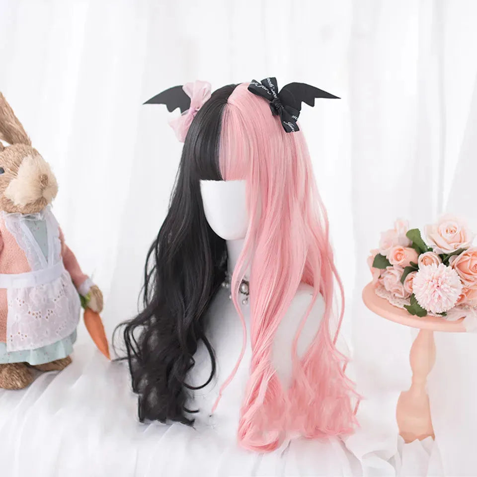 Harajuku Japanese Lolita style long curly black and pink wig with bangs on a wig stand.