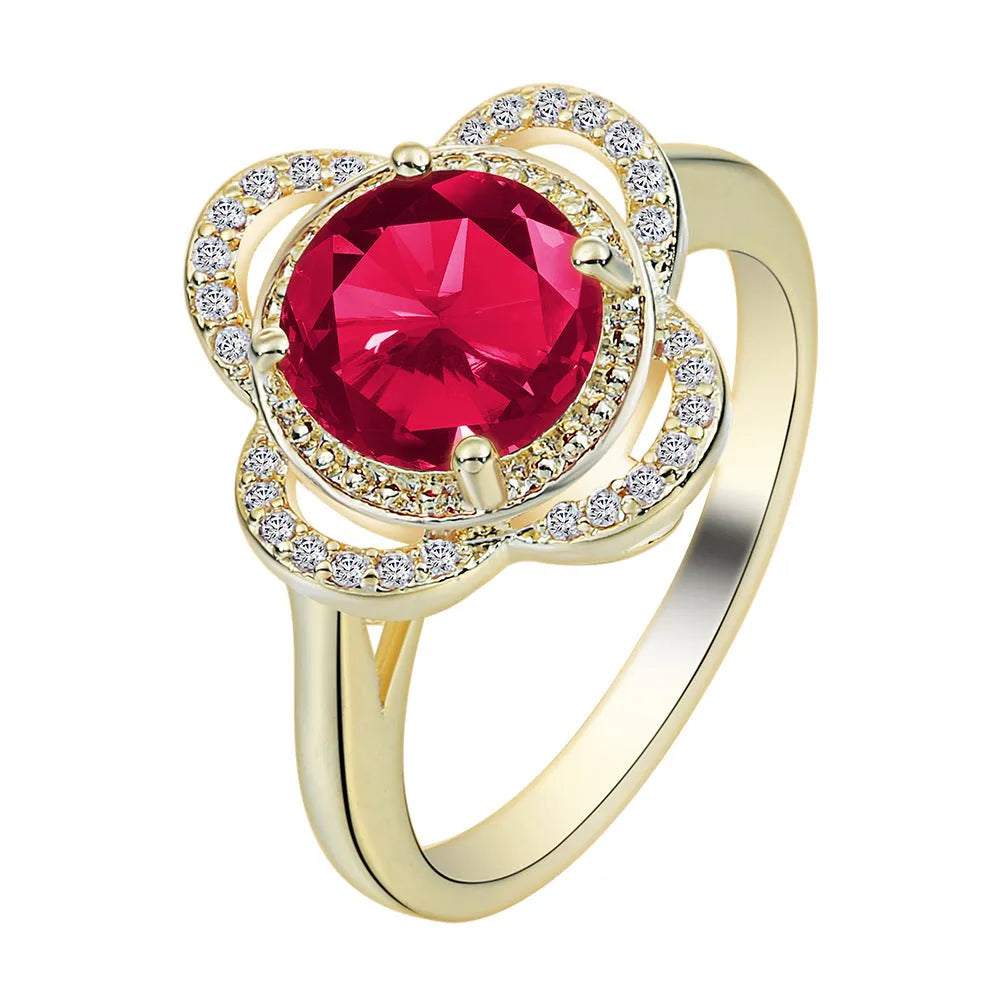 Copper fruit-shaped ring with a zircon stone, showing electroplated finish.