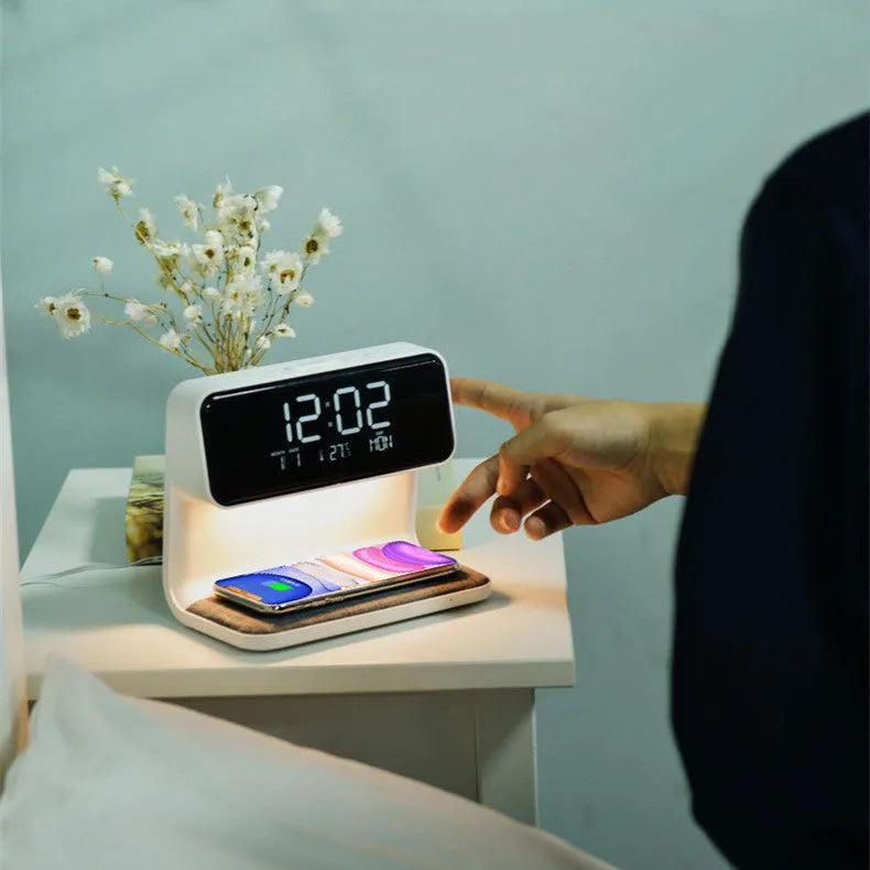 White 3-in-1 bedside lamp with wireless charging pad, LCD clock screen, and fabric-effect ABS shade.