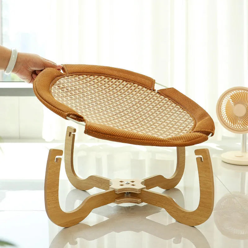 Brown woven rattan pet hammock bed with a cool mat for cats and small dogs.