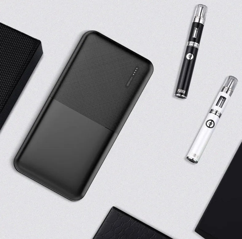 Black and white 20000 mAh power bank with multiple USB ports and plastic casing
