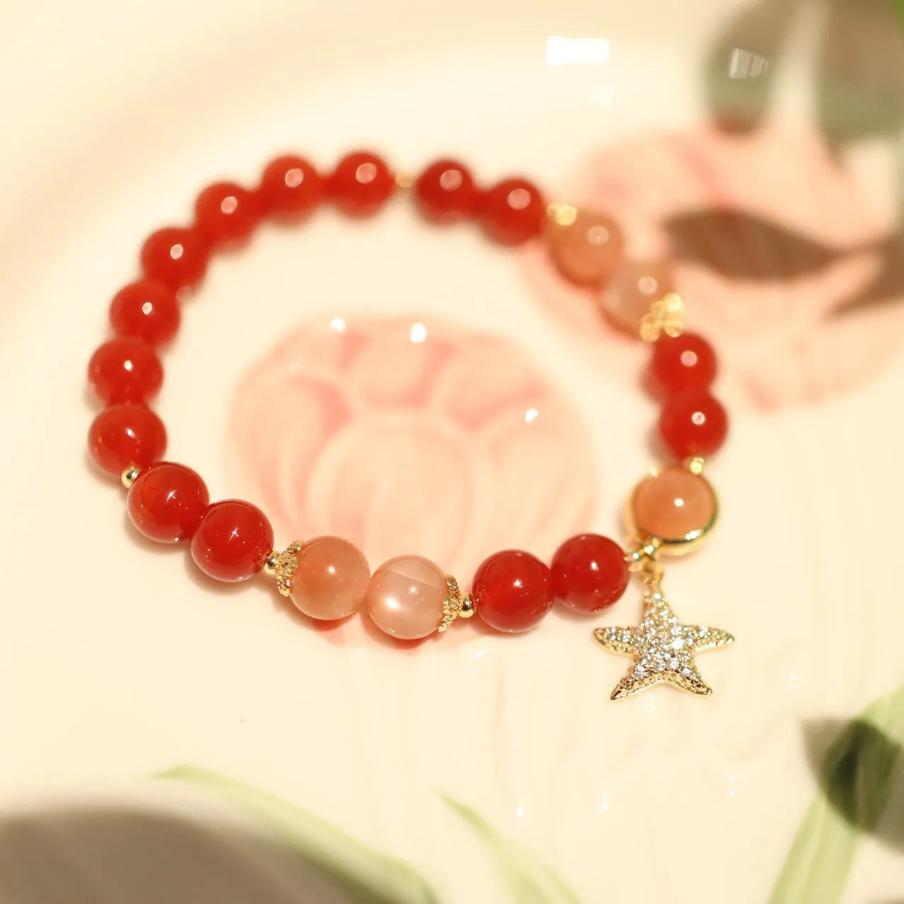Handmade women's red agate bracelet with 8mm stones and ethnic star design featuring Xiangyun elements