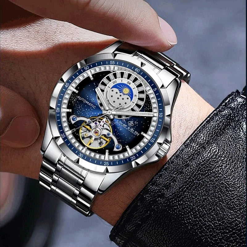 Men's silver alloy automatic watch with blue dial and stainless steel butterfly clasp strap.
