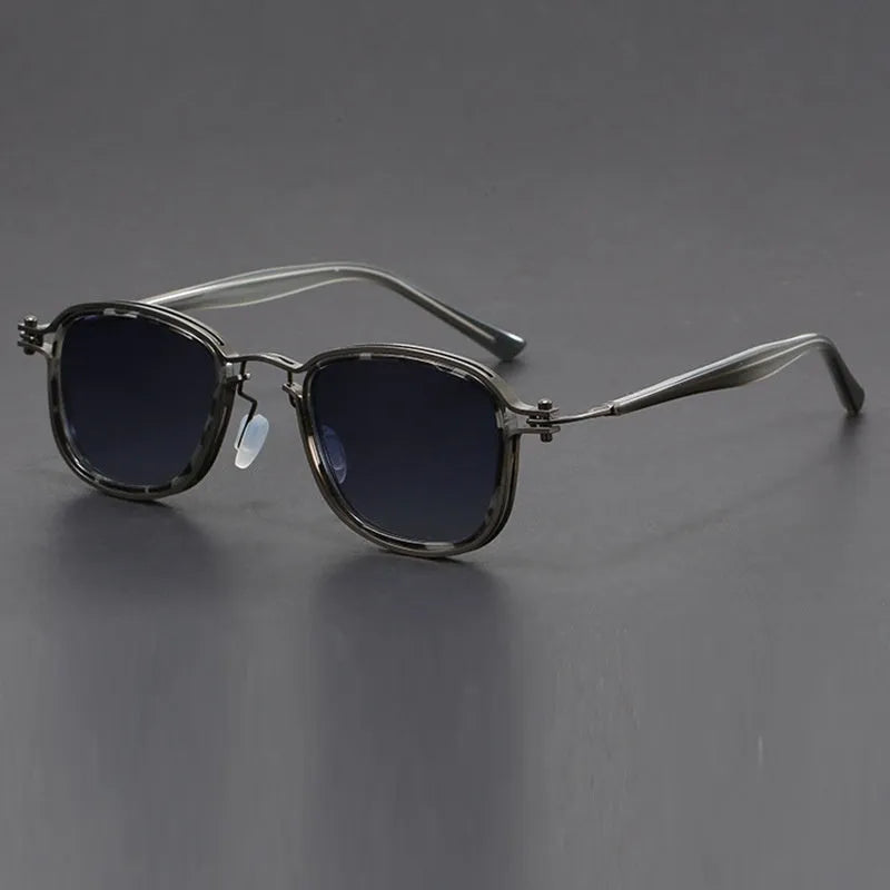 Retro square frame sunglasses with AC lenses in a Black Gold Full Gray colour finish.