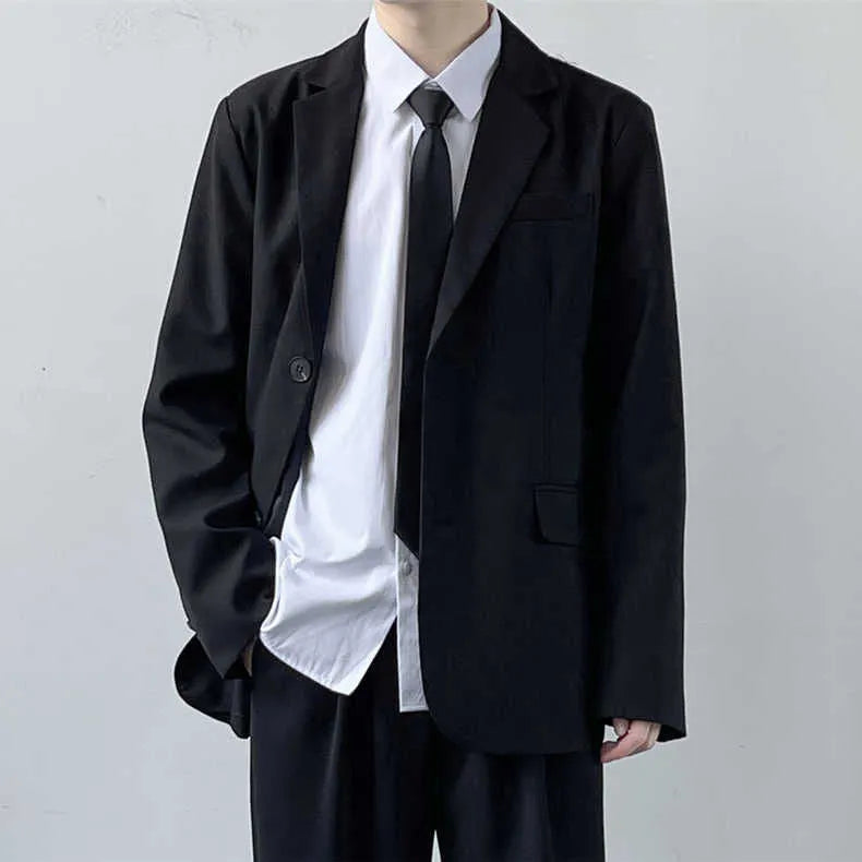 Plus size men's grey suit jacket and trousers set with white shirt and blue tie on a hanger