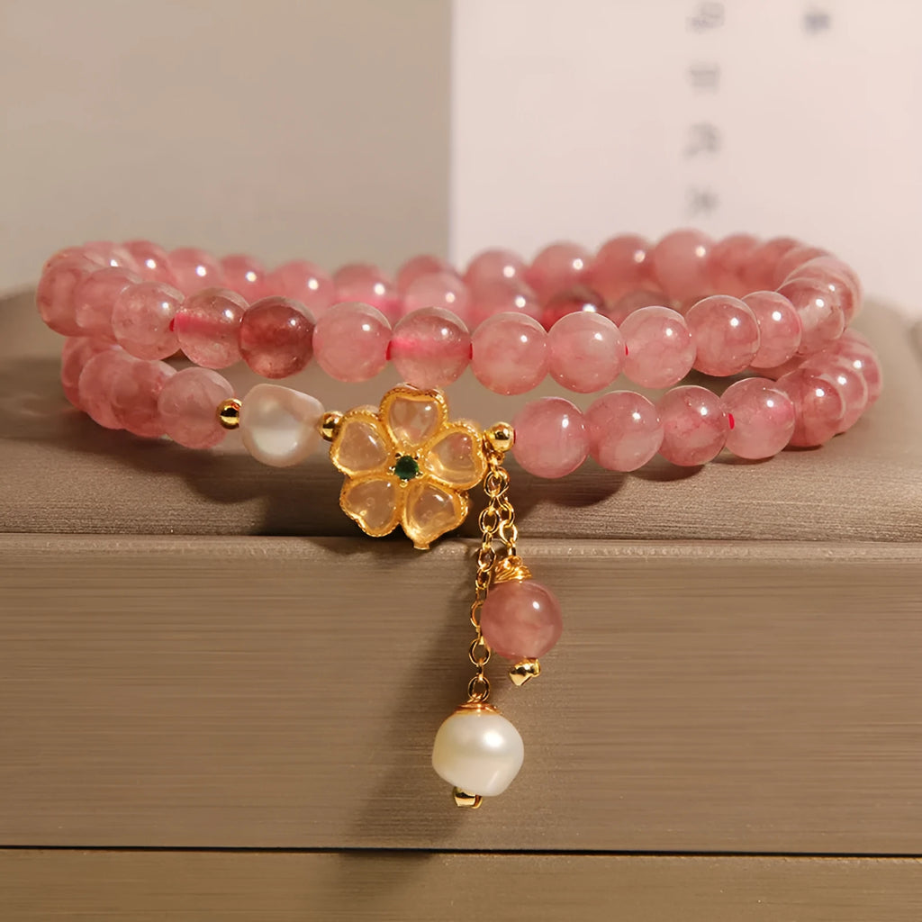 Women's double ring bracelet with strawberry quartz four-leaf clover charm and alloy inlay detailing