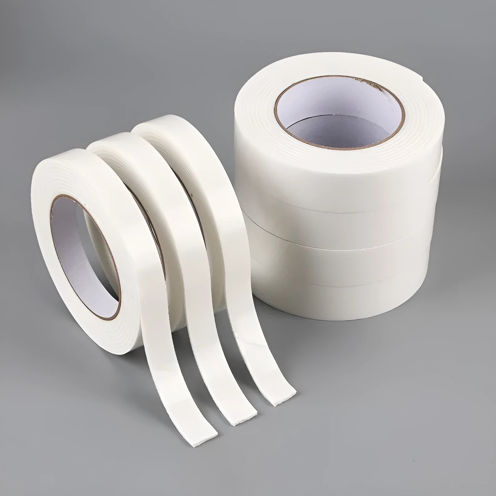 Foam double-sided adhesive tape roll showing 3mm thickness with measurements for 15mm, 18mm, and 30mm width options