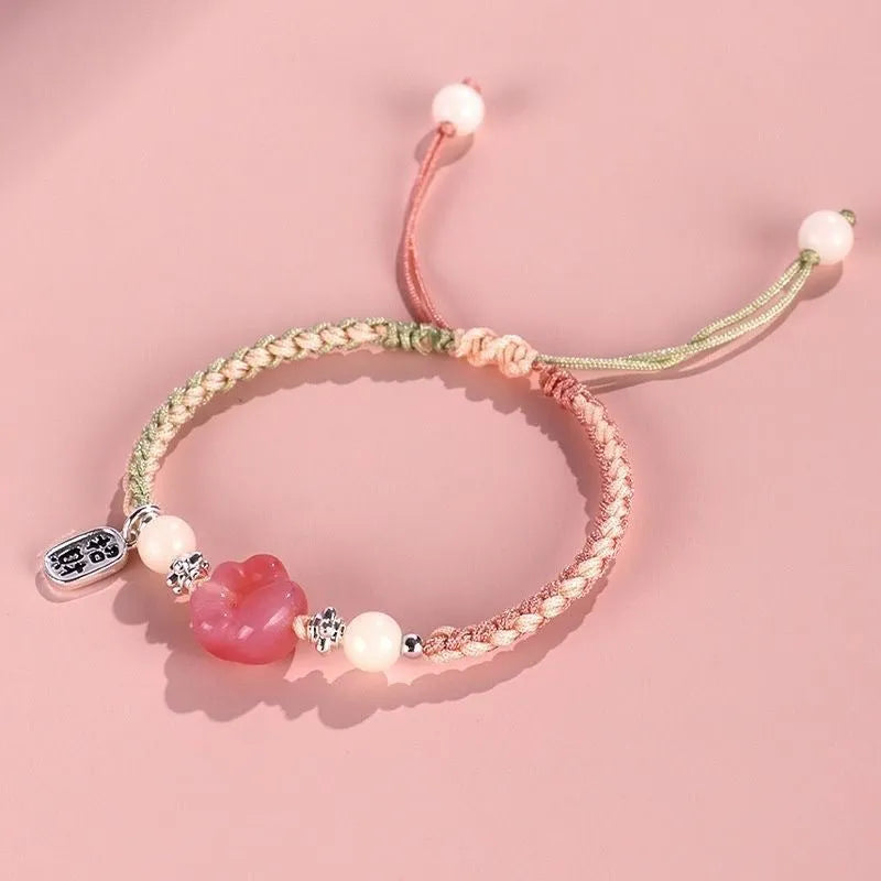 Handmade red cat's paw charm bracelet with woven band in pink or yellow colour for couples